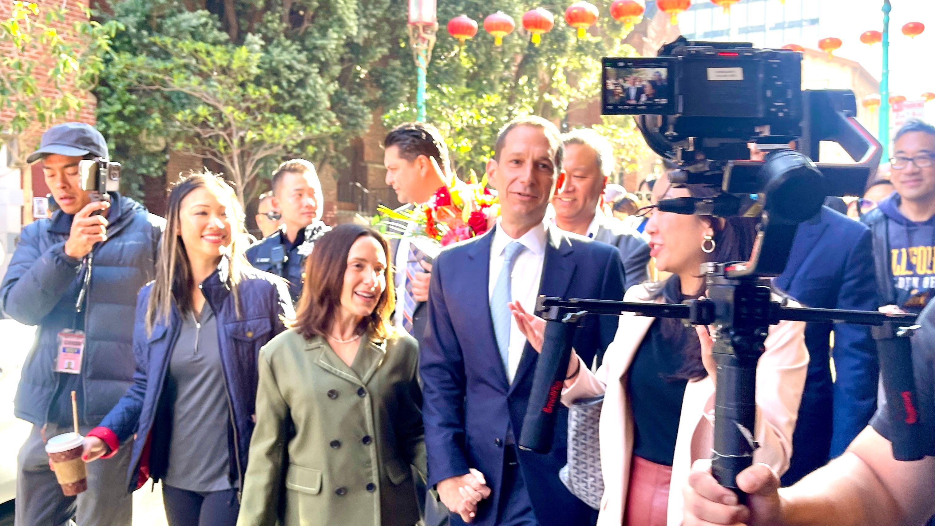 Mayor-Elect Daniel Lurie walks through San Francisco Chinatown with his wife Becca Prowda to thank for the support after declaring victory. Photo by Portia Li