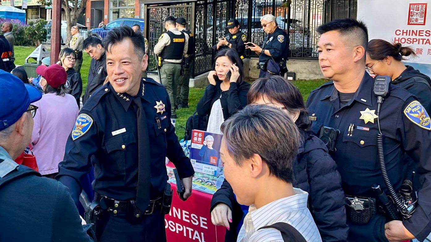 Interim Police Chief Paul Yep (left) and Lieutenant Kin Lee (right) attend the Chinatown Night Out event in Portsmouth Square on September 3. Courtesy SFPD