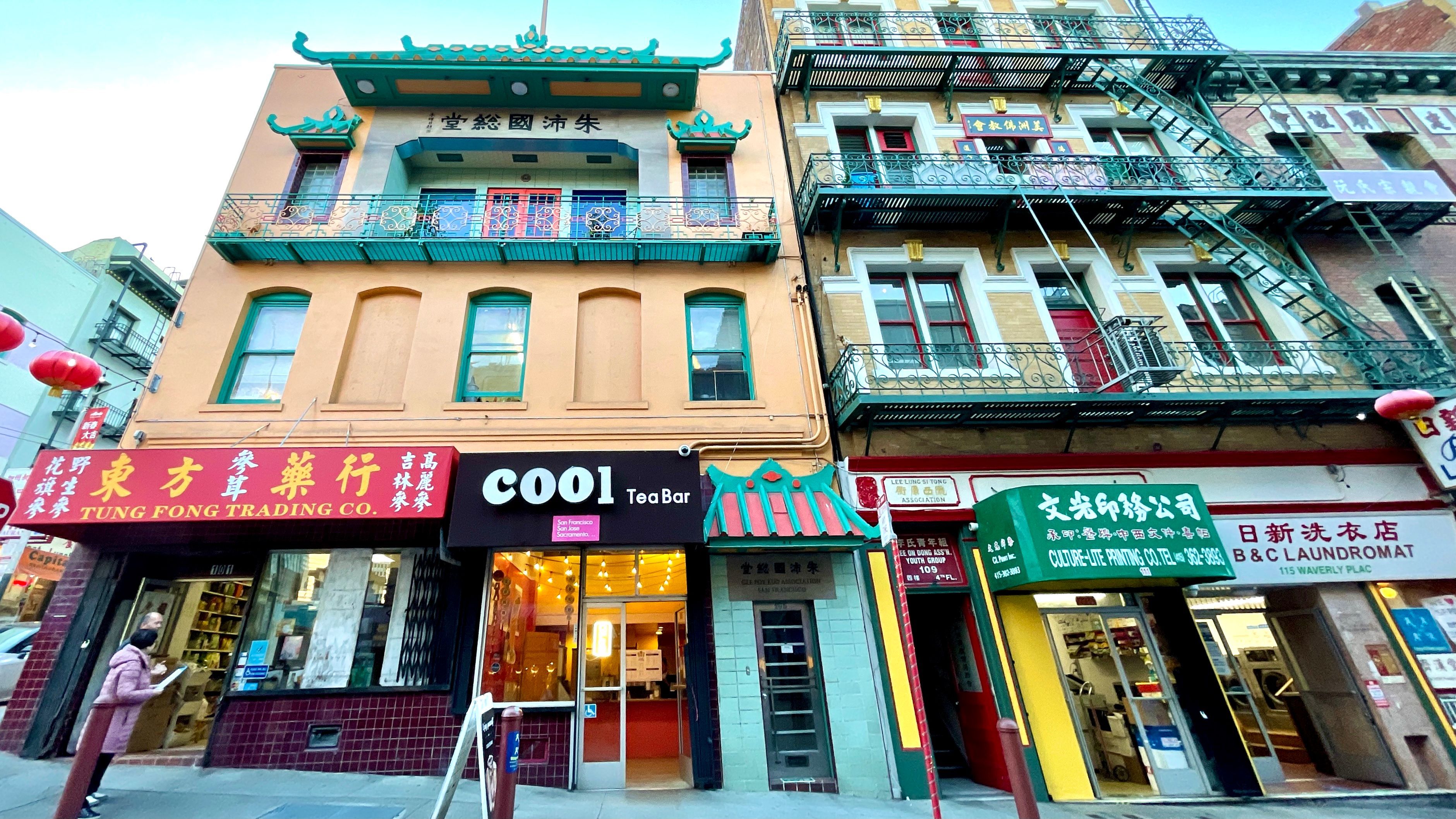 The stores on Waverly Alley in Chinatown, including Tung Fong Trading Co.(from left), Cool Tea Bar, and Culture-Lite Printing Co., all receive notices from San Francisco Department of Building Inspection for awning violations. Photo by Portia Li