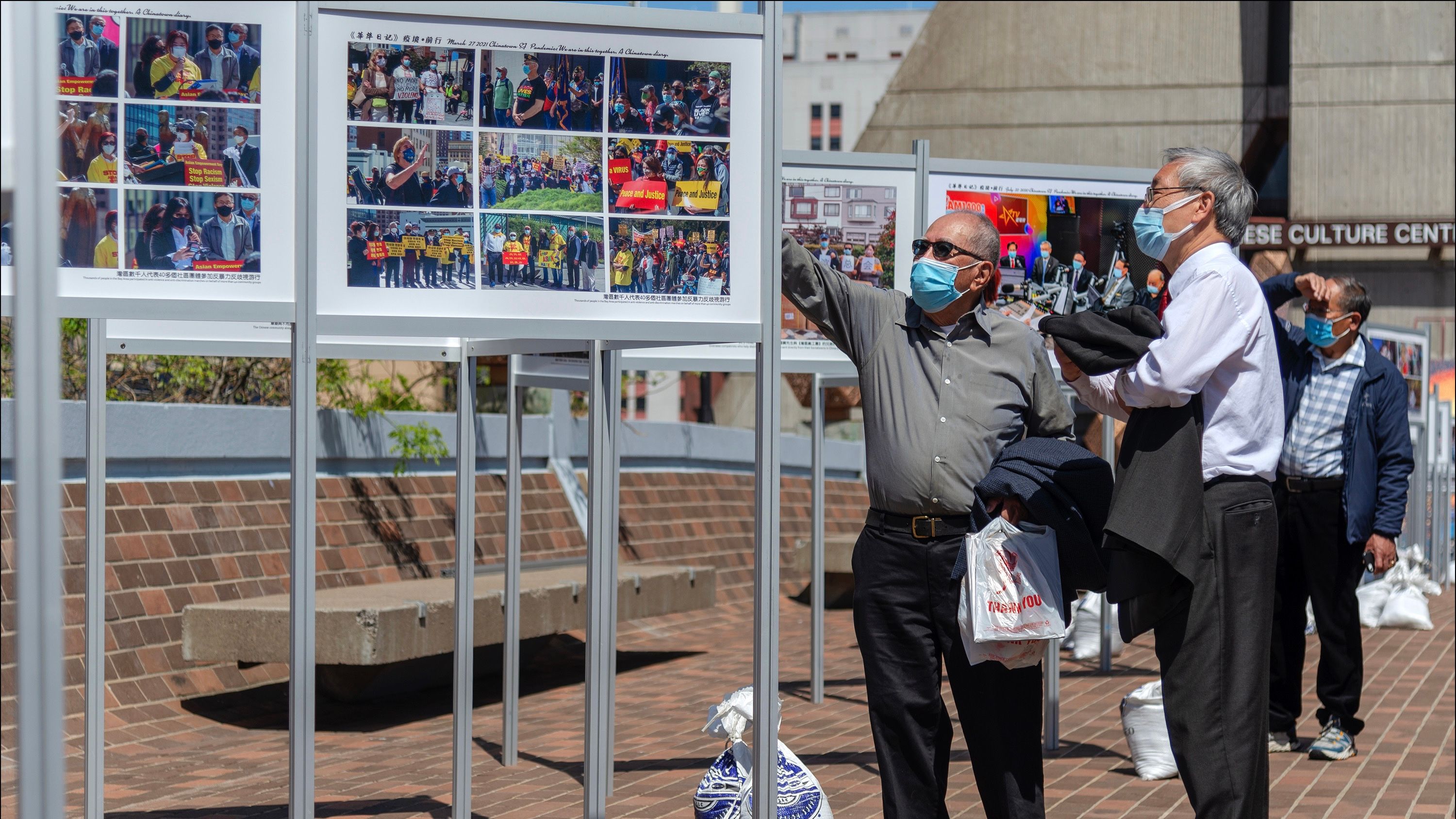 During the peak of the pandemic starting 2020, community groups were able to hold outdoor events including photo exhibits on the Portsmouth Square pedestrian bridge. Courtesy Ding Lee