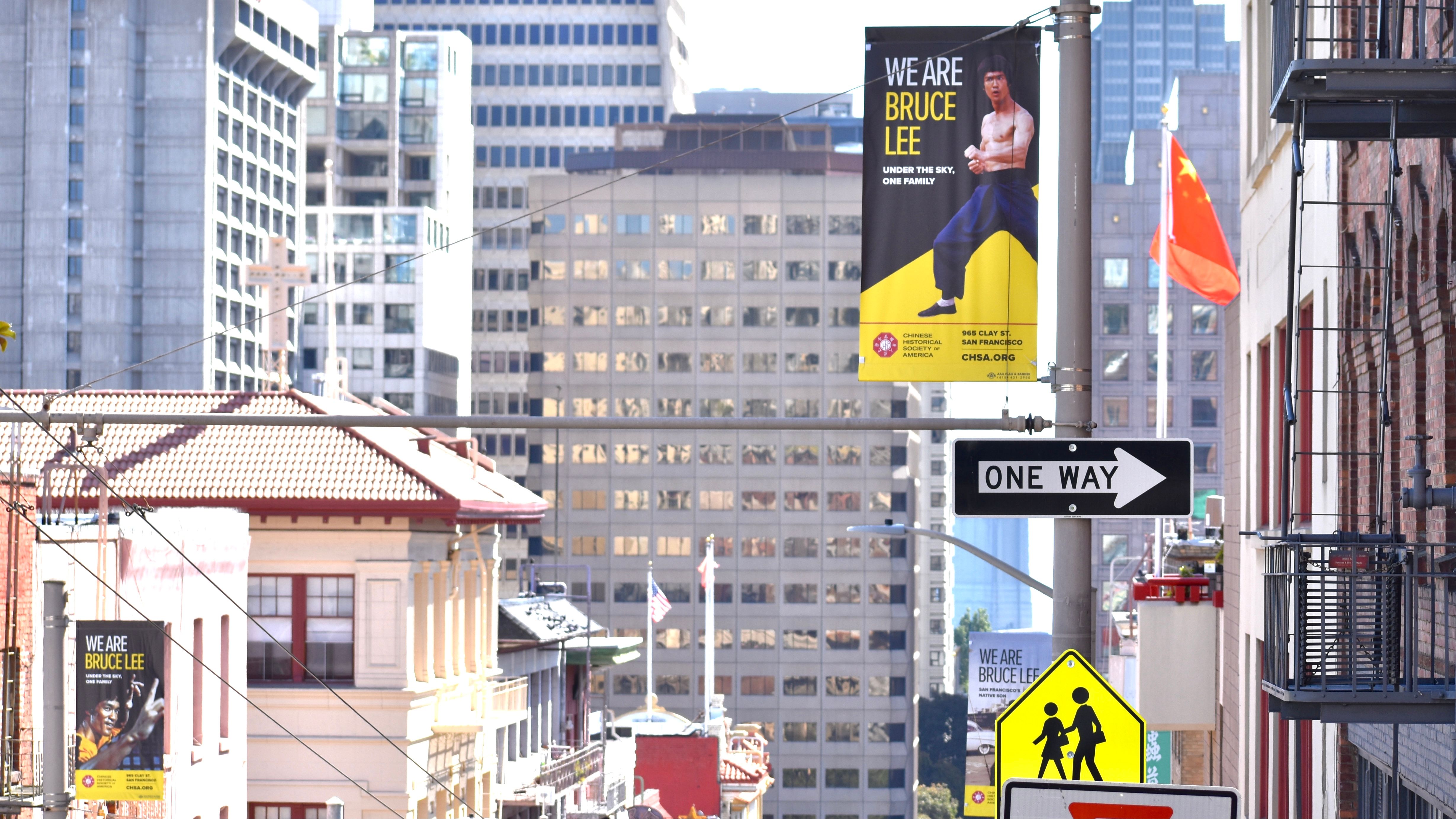 The pole banners which promote the upcoming “We Are Bruce Lee” exhibit are seen all over Chinatown. Photo by Portia Li