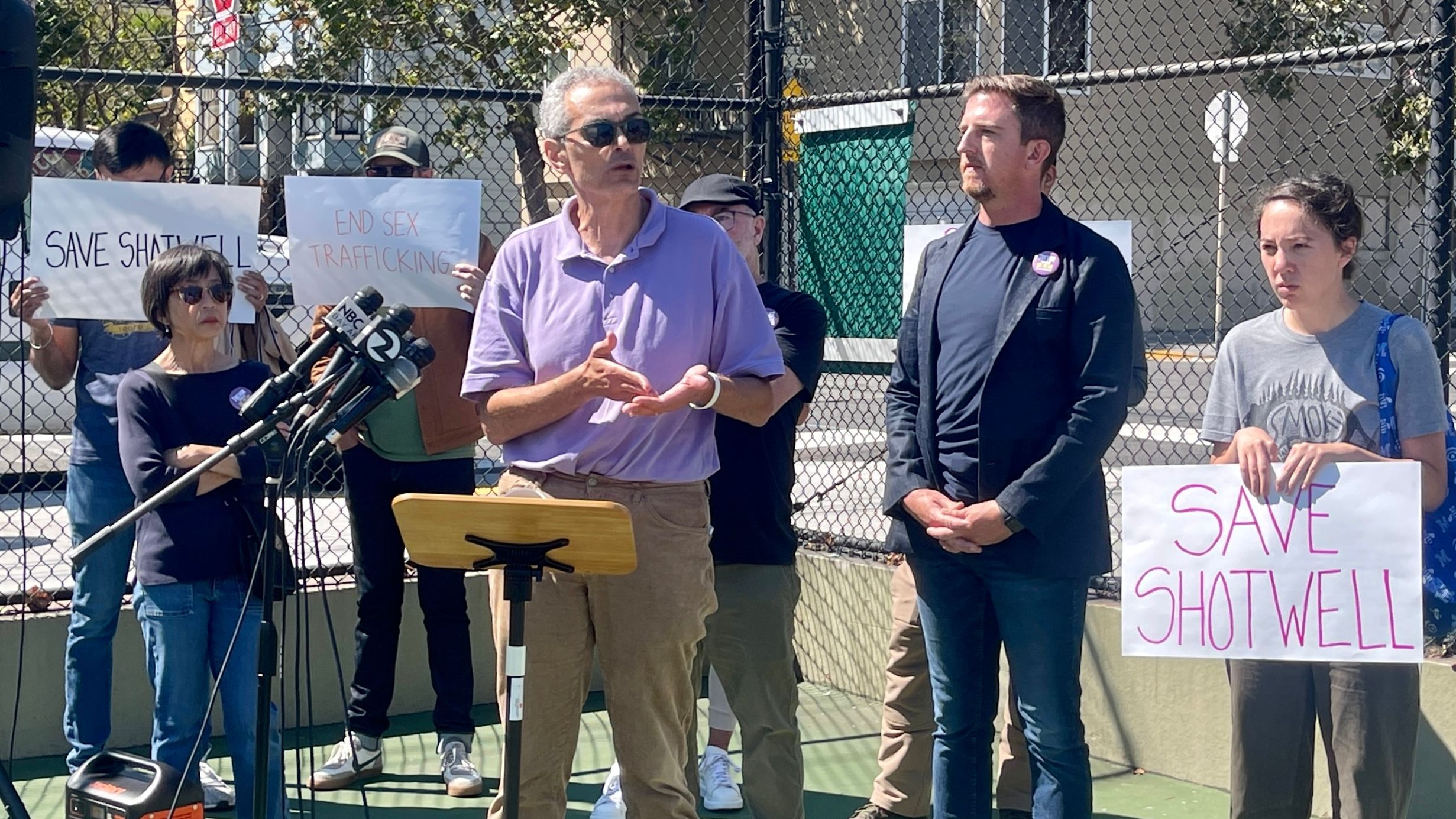 Plaintiff Ayman Farahat (center in front ) and Shotwell Street neighbors announce their lawsuit against the city  at the Jose Coronado Playground in Mission District. Photo by Portia Li