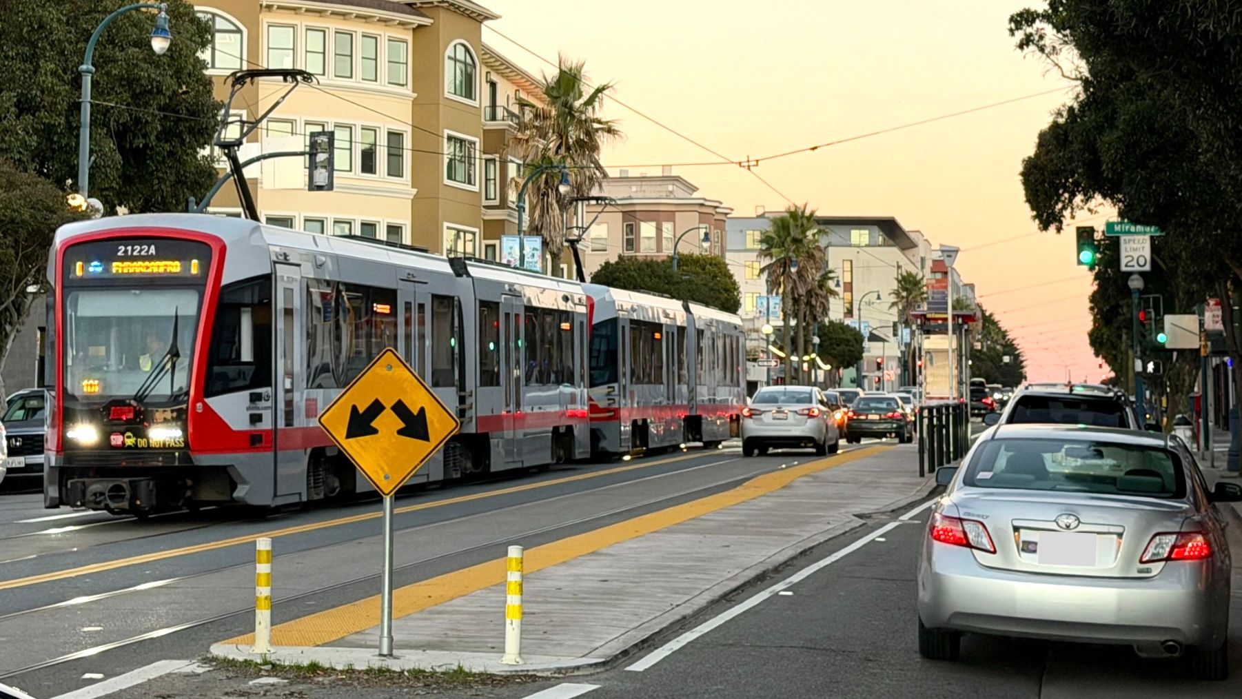 Merchants say the K trains only come every 15 to 20 minutes and the SFMTA’s plan to convert one of the two lanes in each direction on the entire Ocean Avenue along the business corridor into "red transit only” lanes at all times exclusively for K trains would unfairly impact merchants, residents, and motorists who need to share the public street for delivery, work, shopping, and medical appointments. Photo by Portia Li
