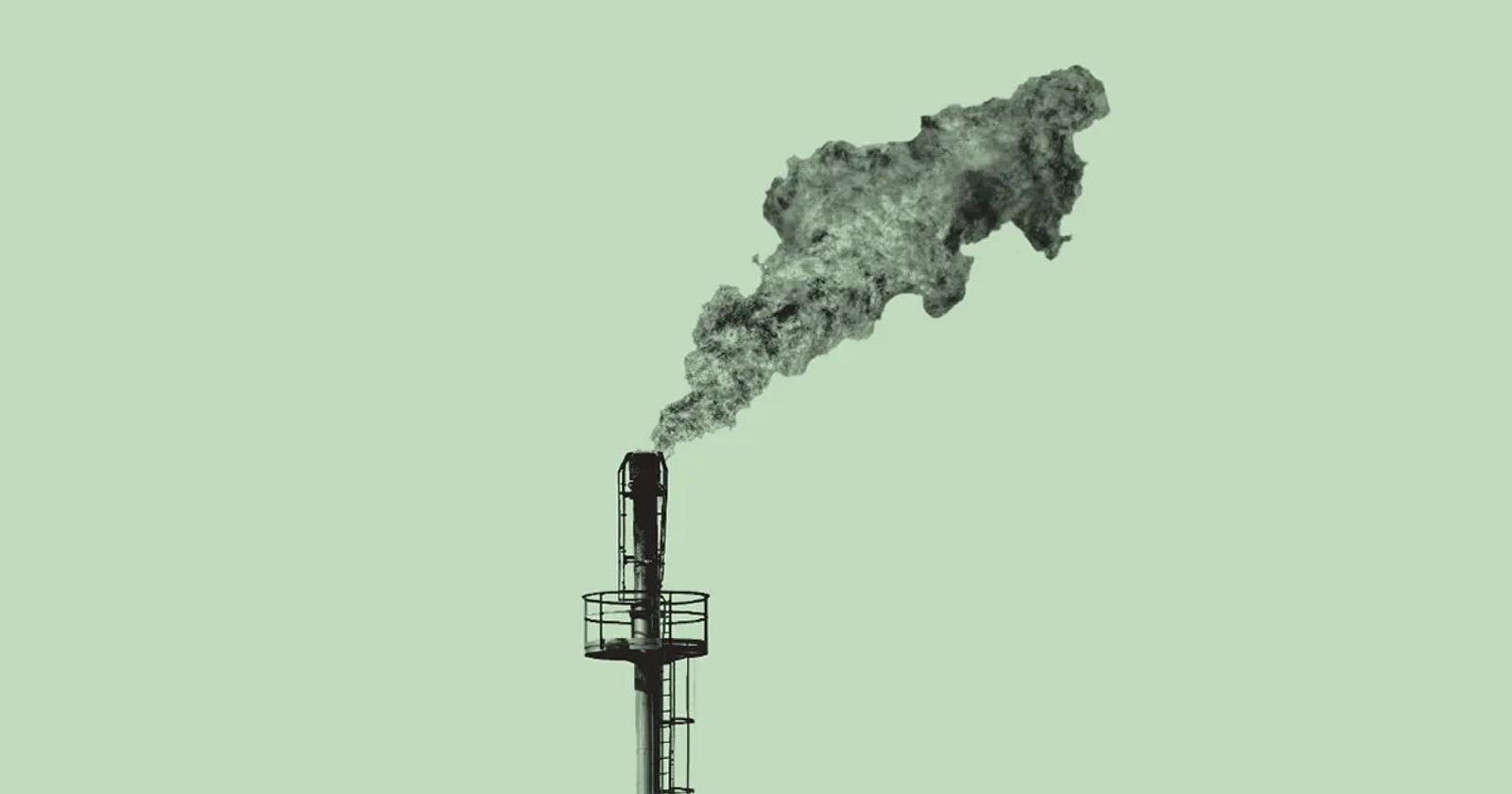 Coal plant exhaust pipe with smoke billowing from it