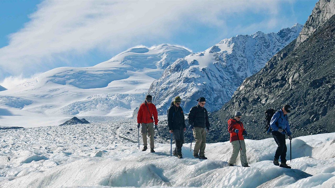 Hikers on a glacier during a heli-hike in Aoraki Mt Cook National Park