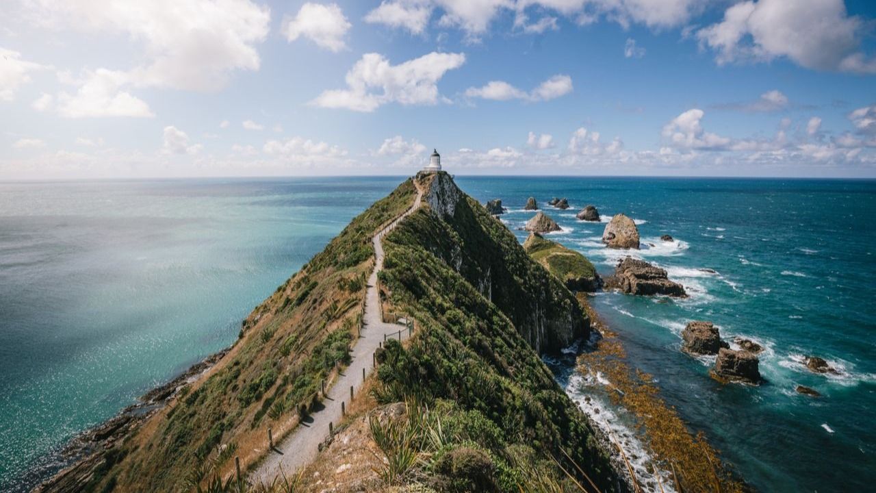 Nugget Point Lighthouse above the rocky coast of the Catlins