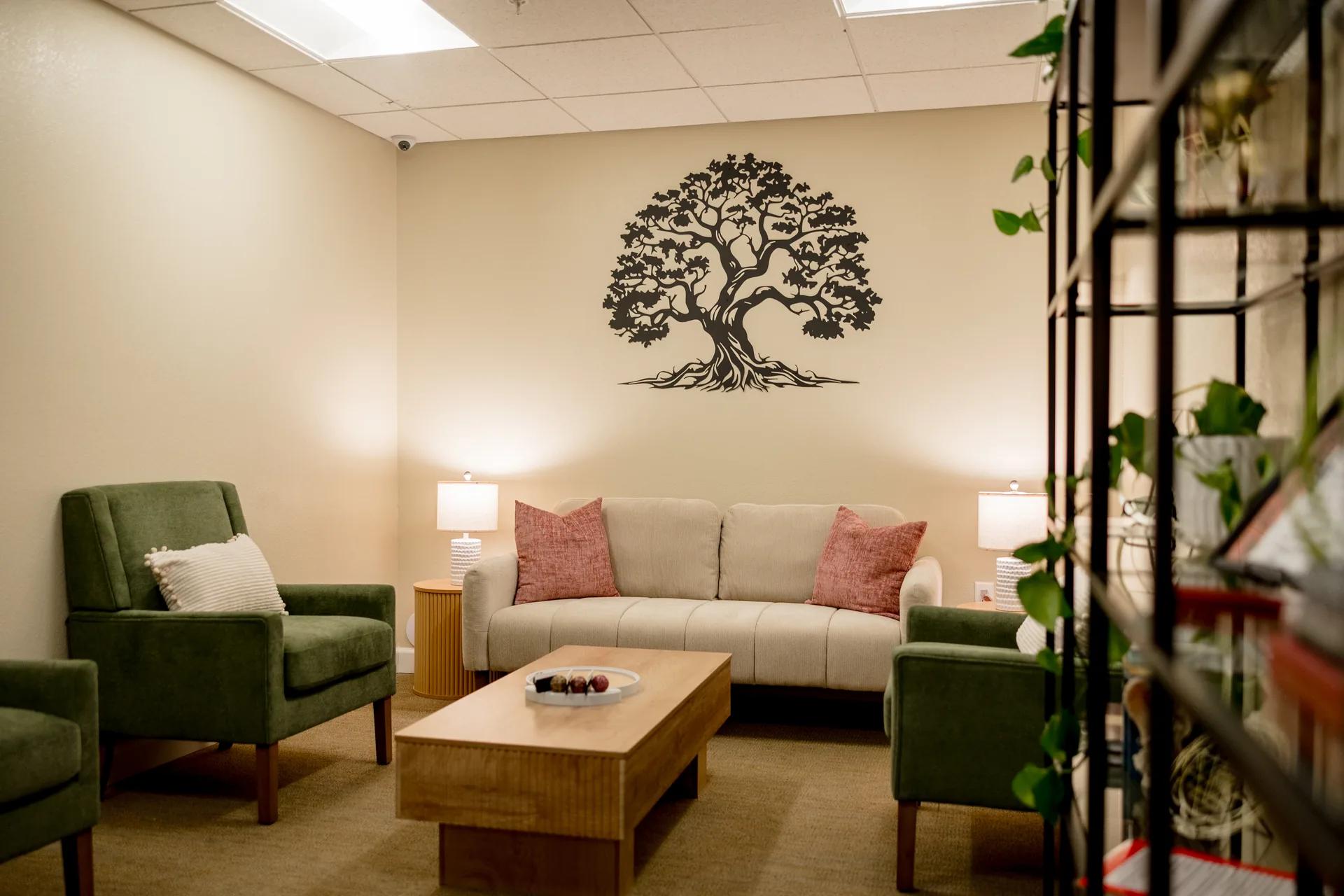 Stonebridge Senior meditation room with comfortable seating and tree artwork