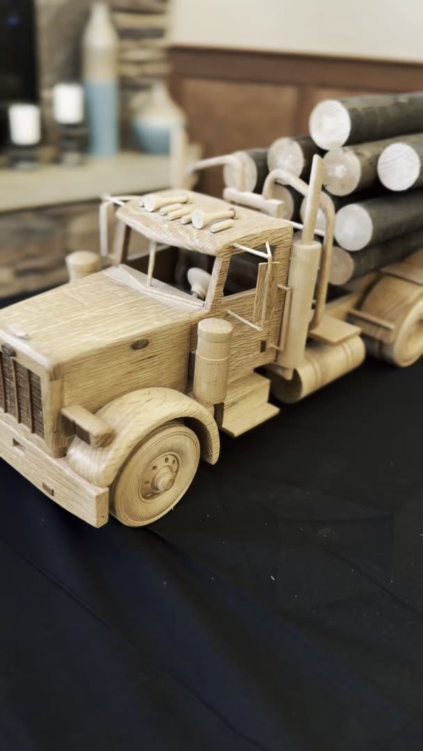 A wooden model truck is displayed during a Gardens on Quail resident creative showcase.