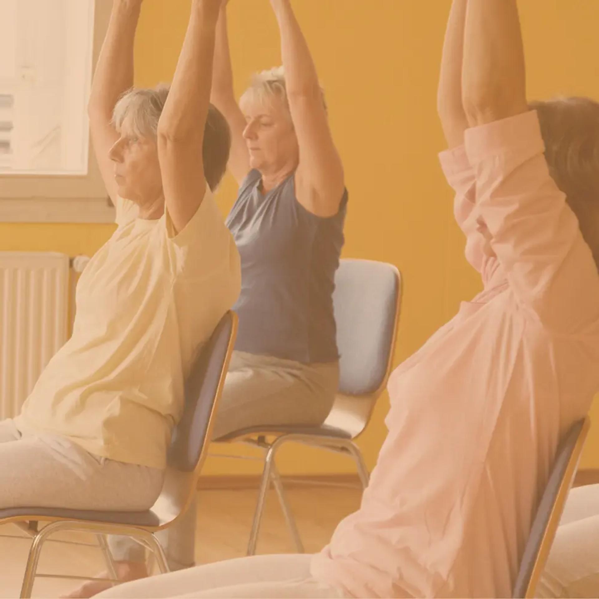 Stonebridge Senior residents participating in a seated chair yoga class