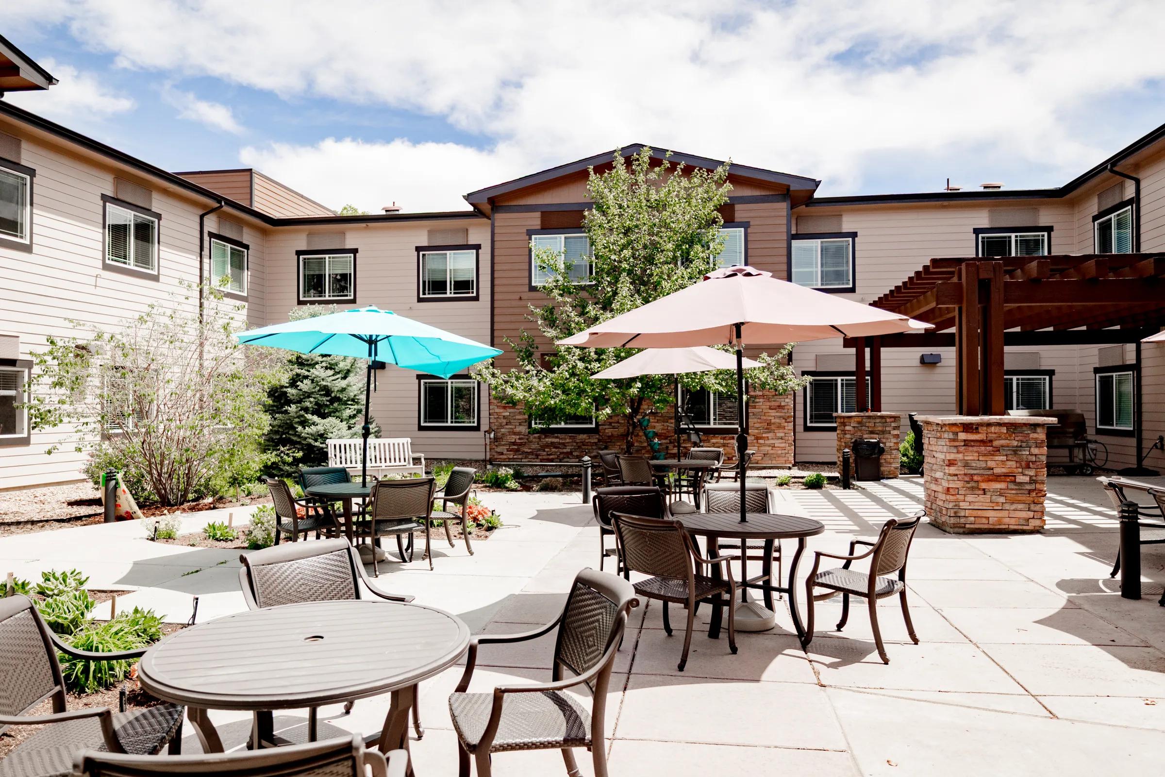 Stonebridge outdoor courtyard with patio tables and colorful umbrellas