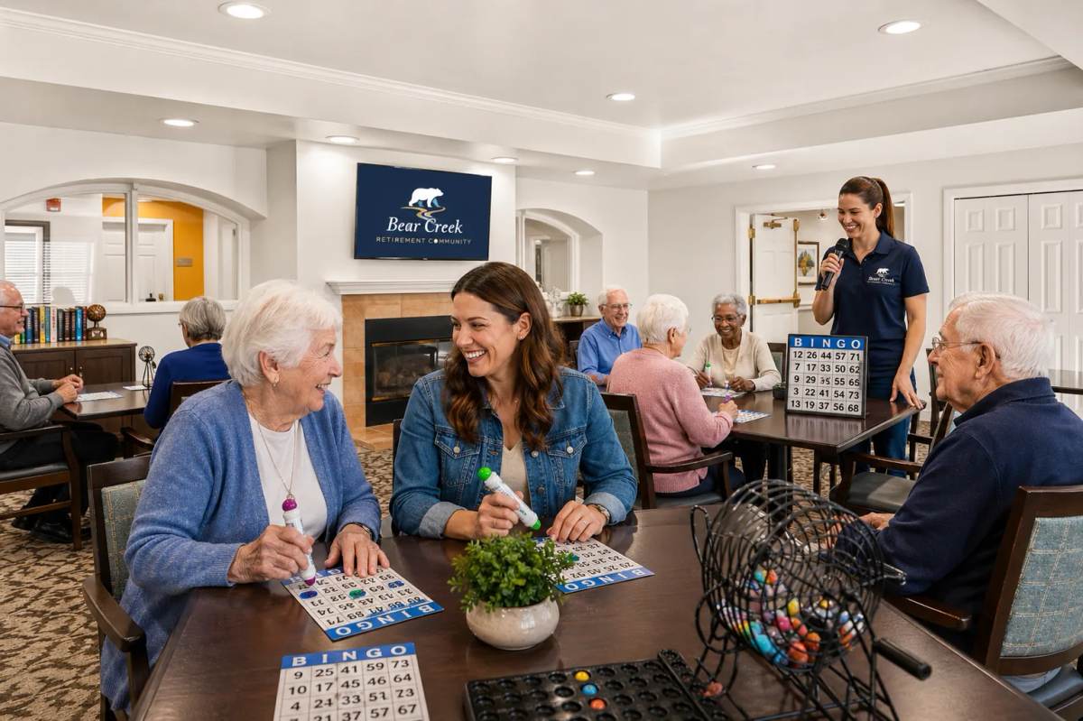 Bear Creek residents and a staff host playing bingo together in the great room