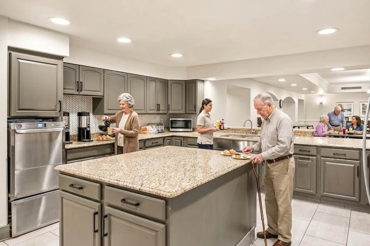 Bear Creek residents chatting over coffee and fresh pastries at the snack room granite island