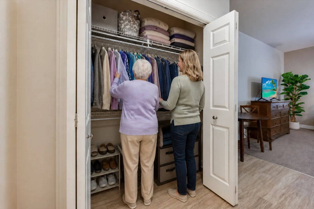 Closet and storage setup in a Bear Creek Lakewood suite for move-in planning.