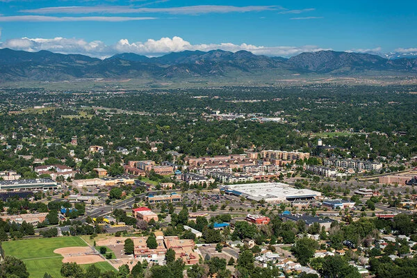 Aerial view of a neighborhood with mountains in the distance