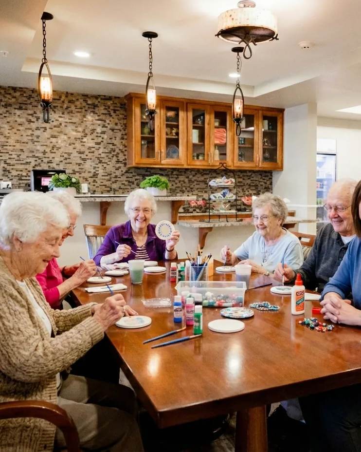 Stonebridge Senior residents and a team member gathered for a craft activity