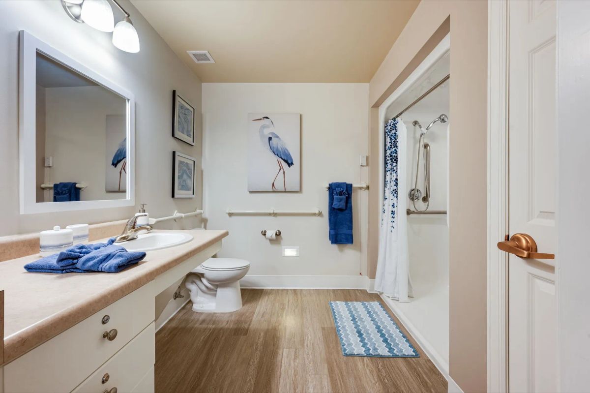 Accessible bathroom in a Bear Creek Lakewood apartment for assisted living support needs.
