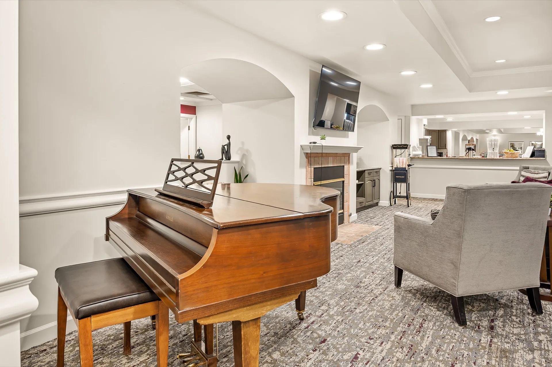 Community fireplace lounge in Lakewood where memory care families meet with staff.