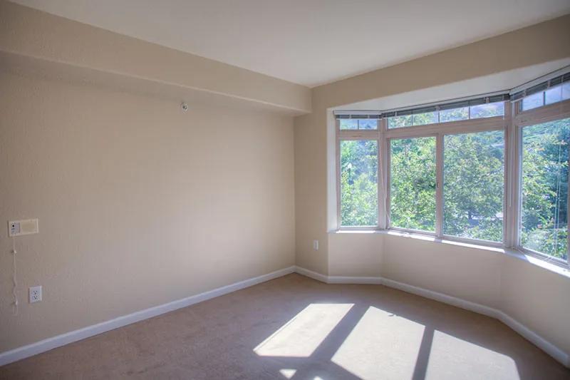 Golden Pond independent living apartment bedroom with large windows and natural light