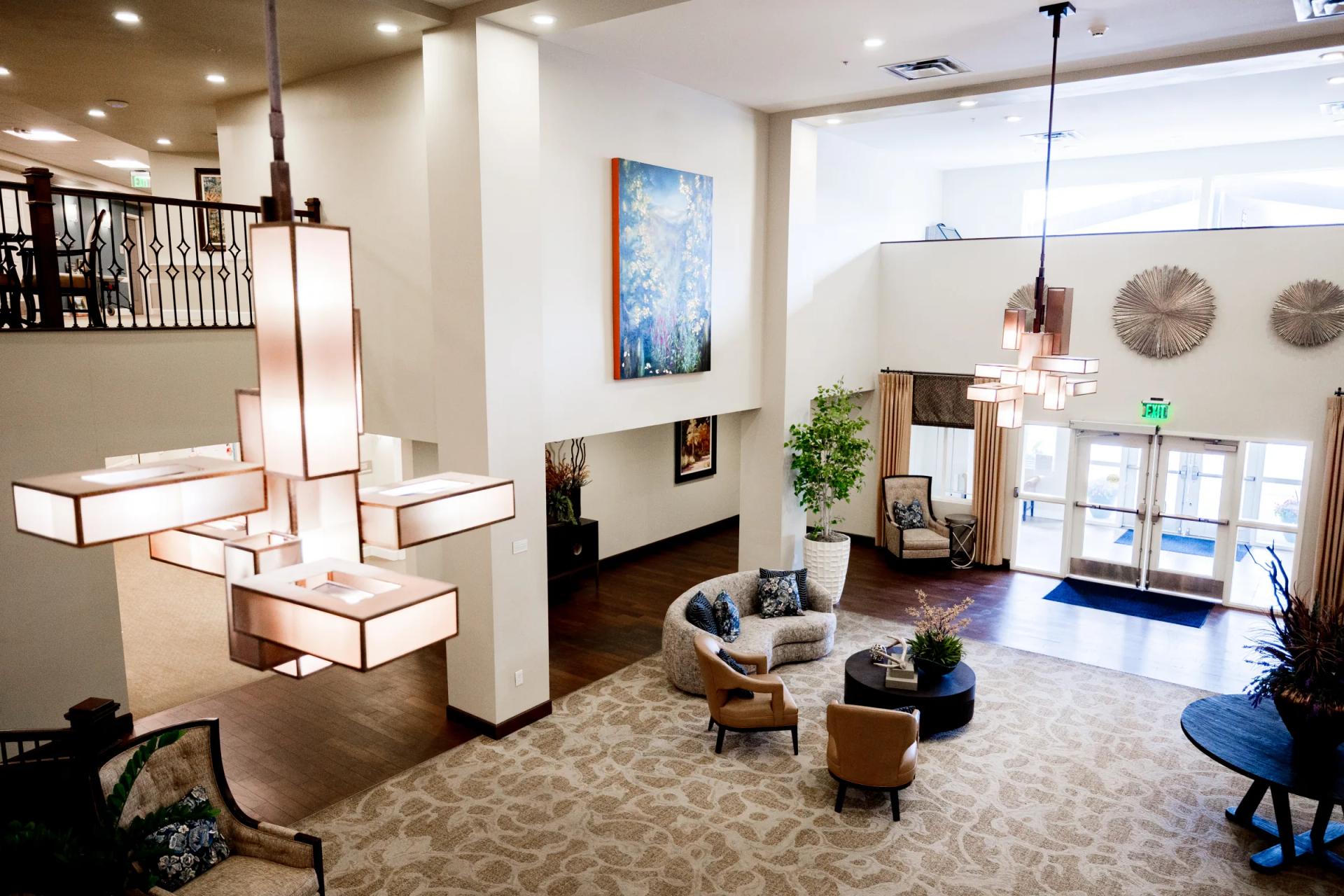 Stonebridge lobby with cascading modern pendant lights and main entry doors