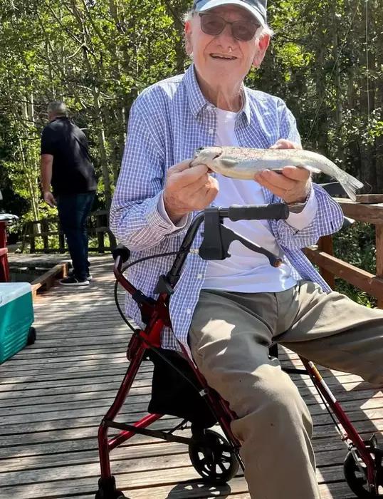 Residents enjoying a fishing outing at Gardens at Columbine