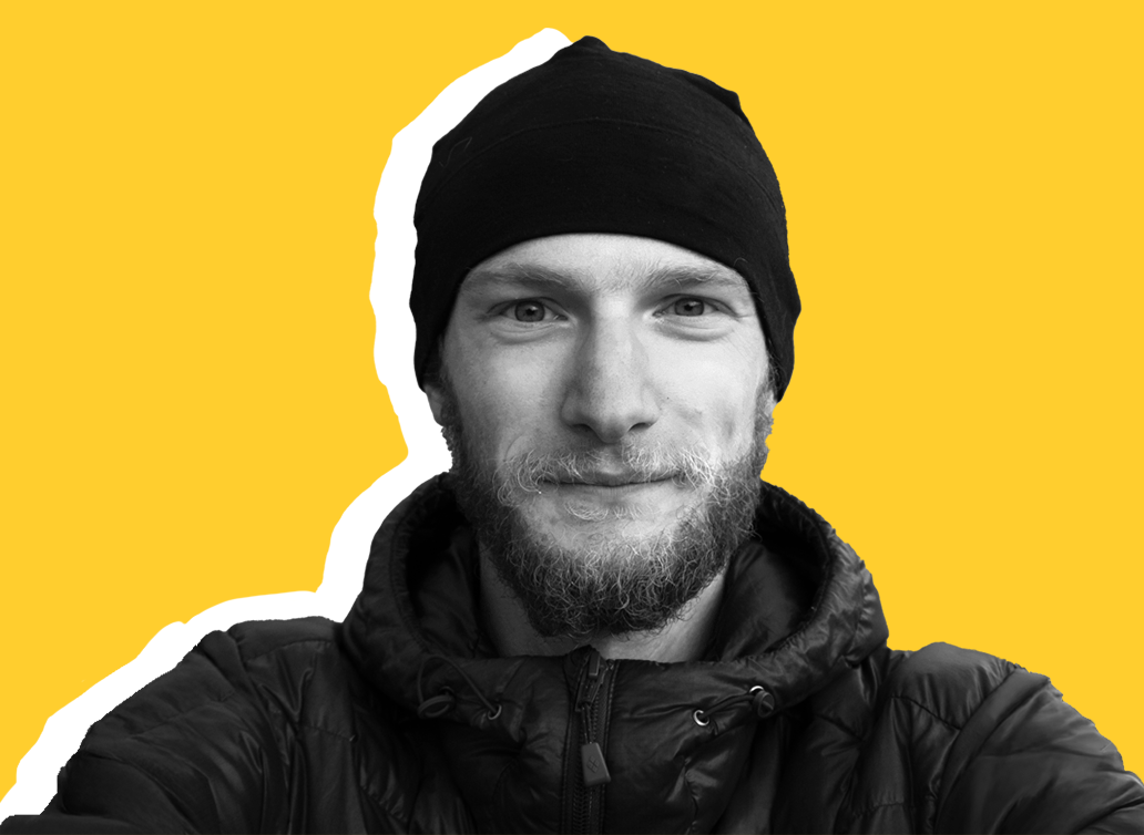 Stefan staff photo with yellow background 