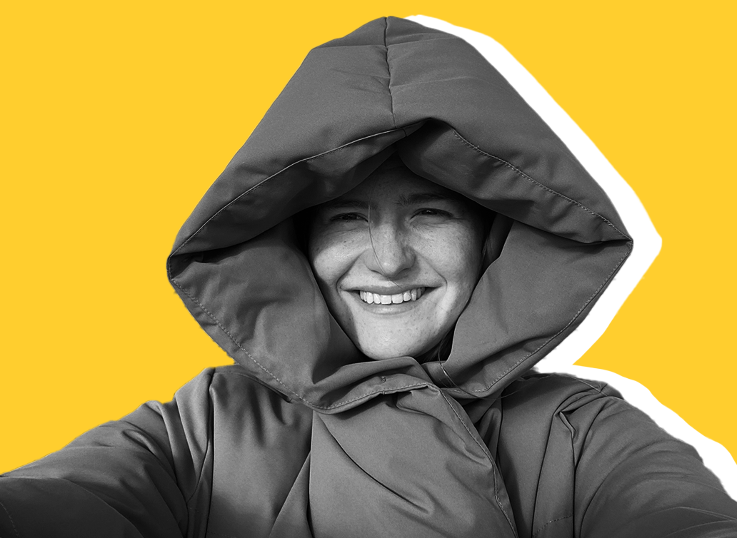 Laura Bell staff photo yellow background