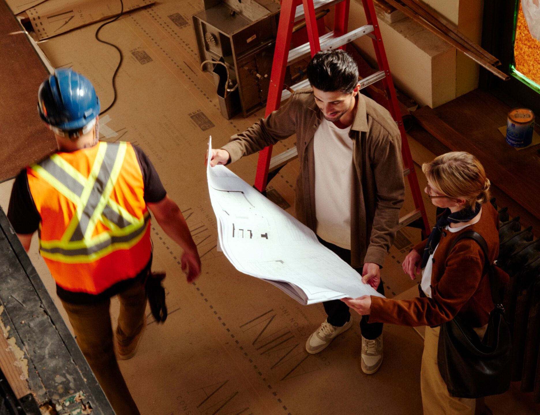 construction people looking at blueprints