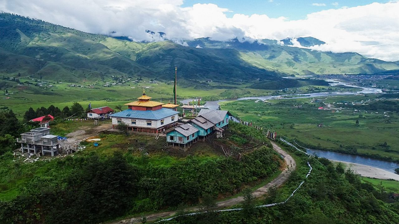 Alt-Text: > A panoramic view of the eco-friendly bamboo stages at the Ziro Valley Music Festival 2026 in Arunachal Pradesh, surrounded by the UNESCO-recognized Apatani terraced rice fields.
