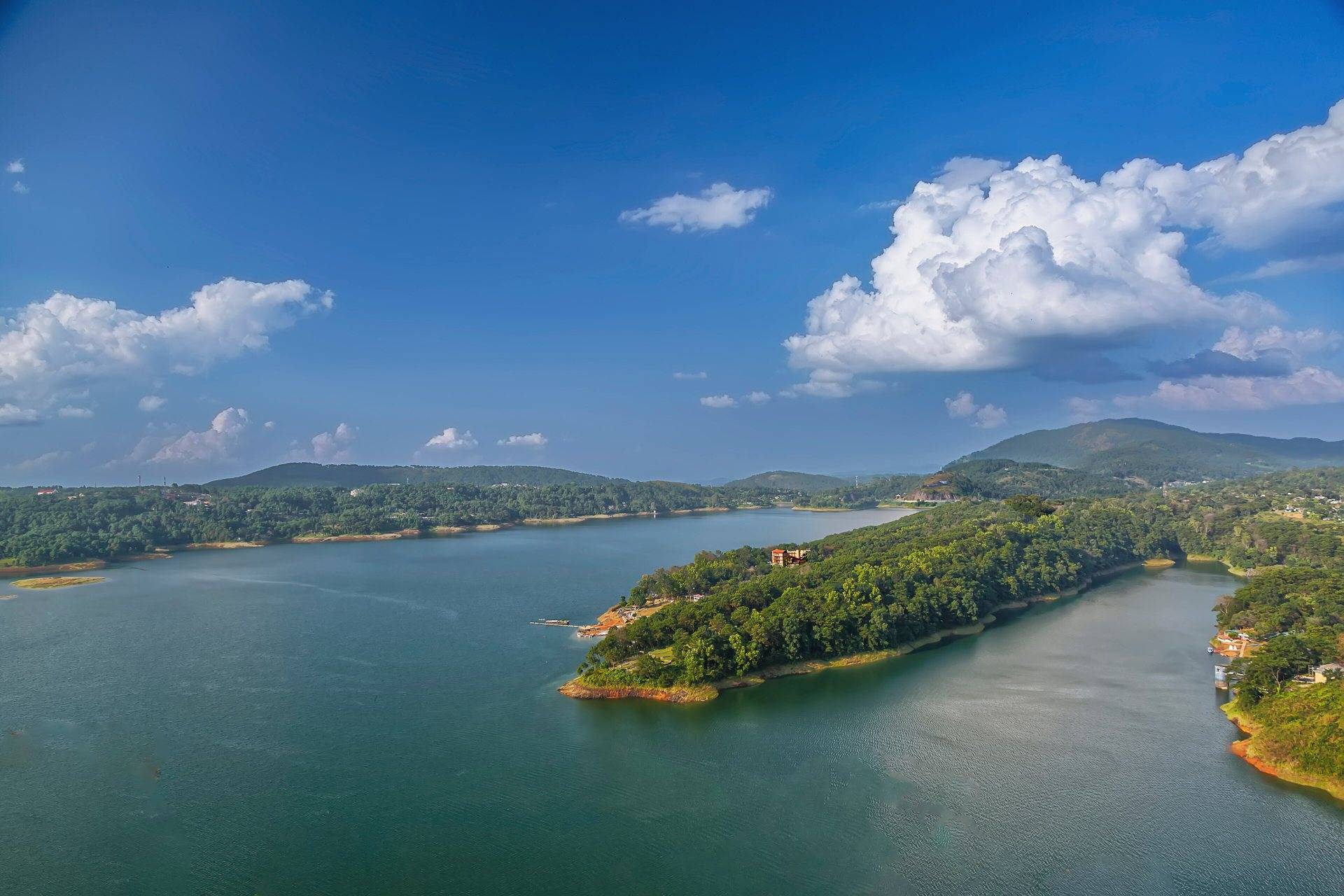 Umiam Lake surrounded by pine-covered hills near Shillong
