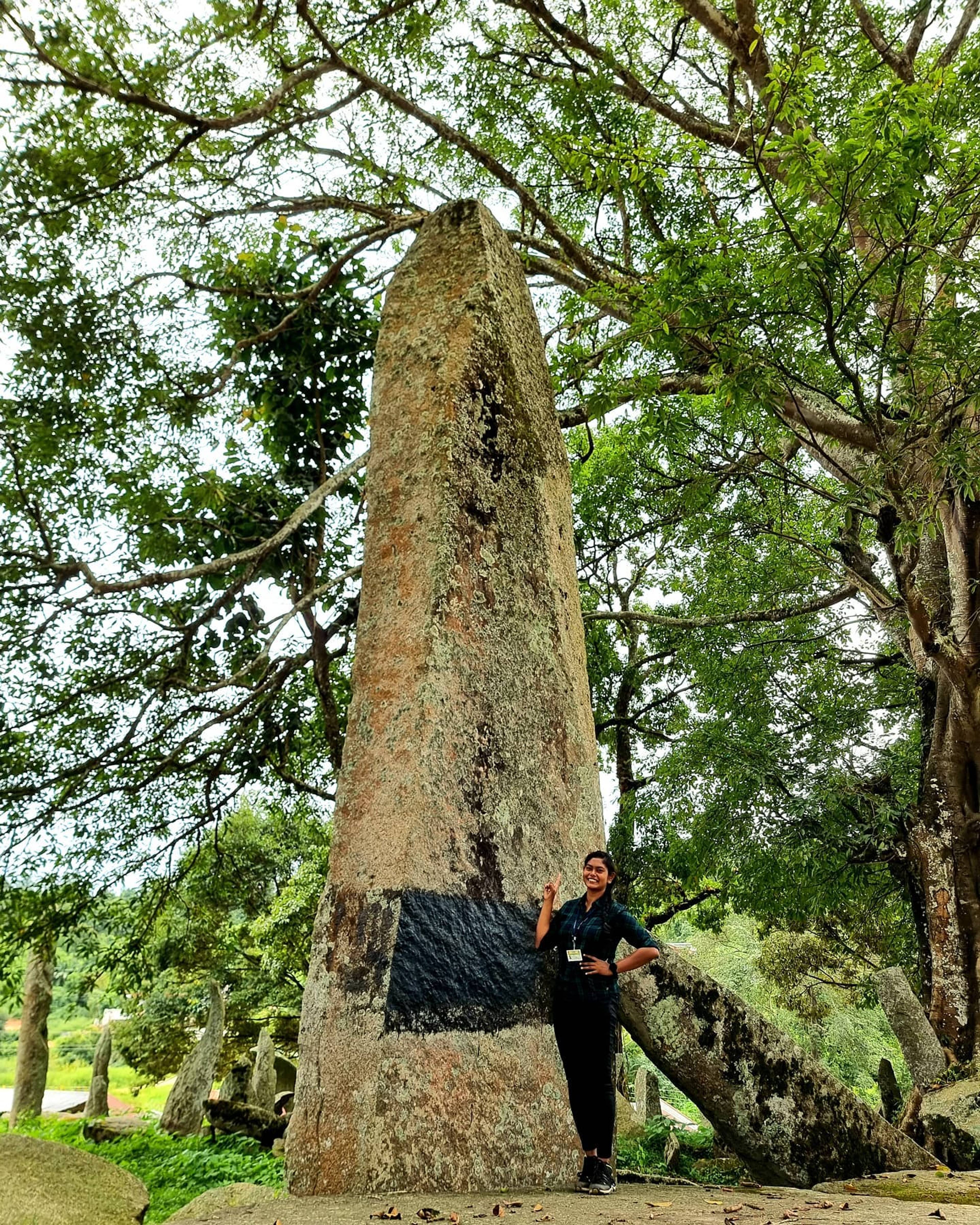 Tall standing stones and flat table stones in the Nartiang monolith garden