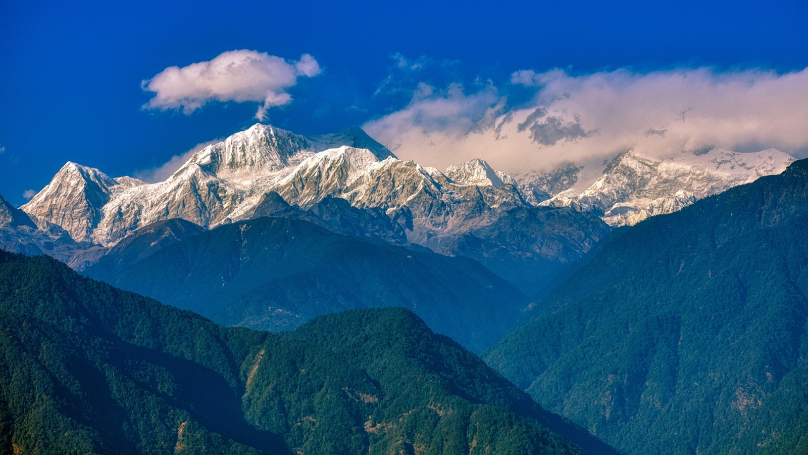 Panoramic view of the rugged , white mountain range in sikkim.