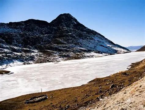 Colorful Sela Pass gateway with deep winter snow in Arunachal Pradesh.