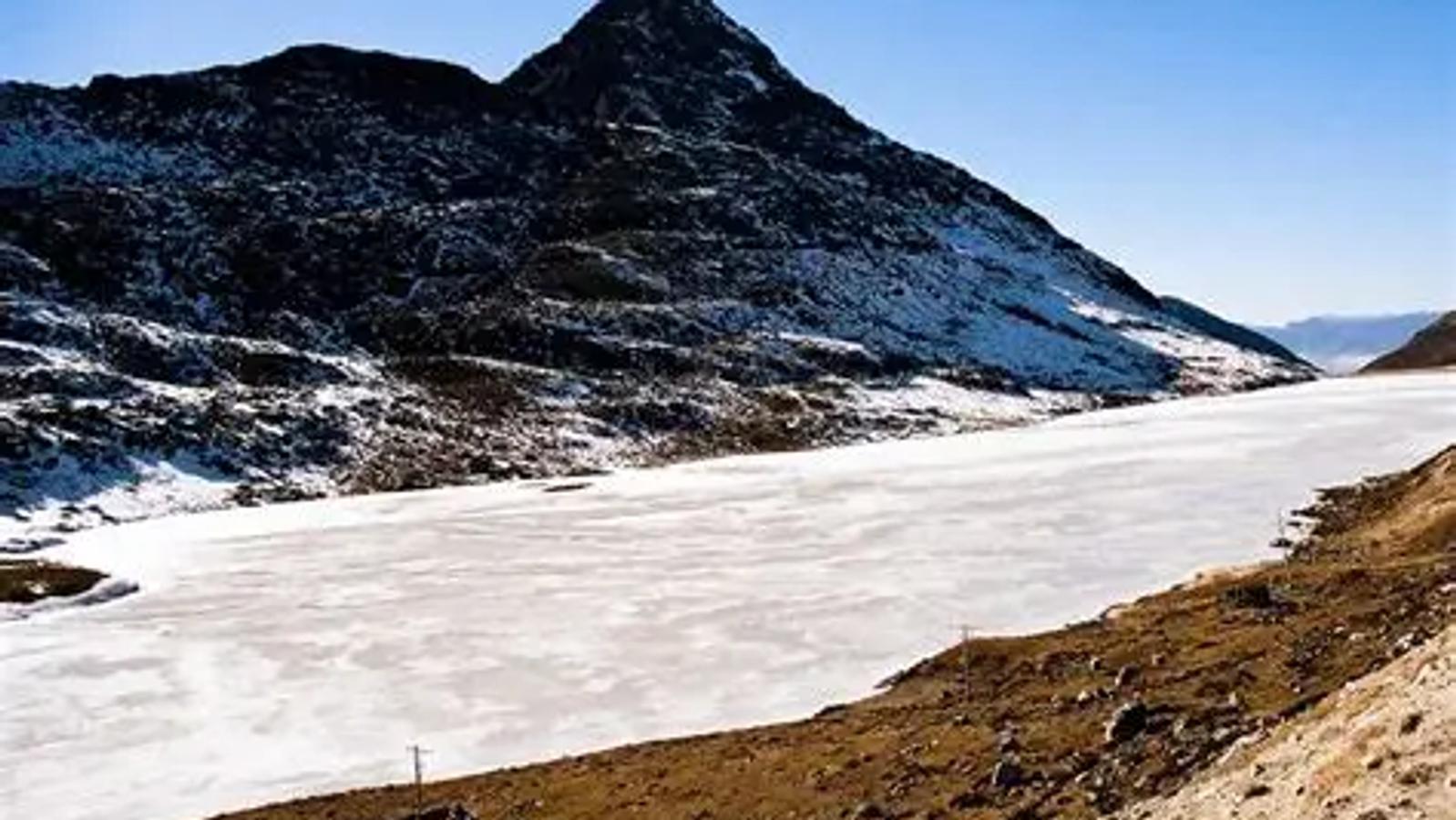 Colorful Sela Pass gateway with deep winter snow in Arunachal Pradesh.