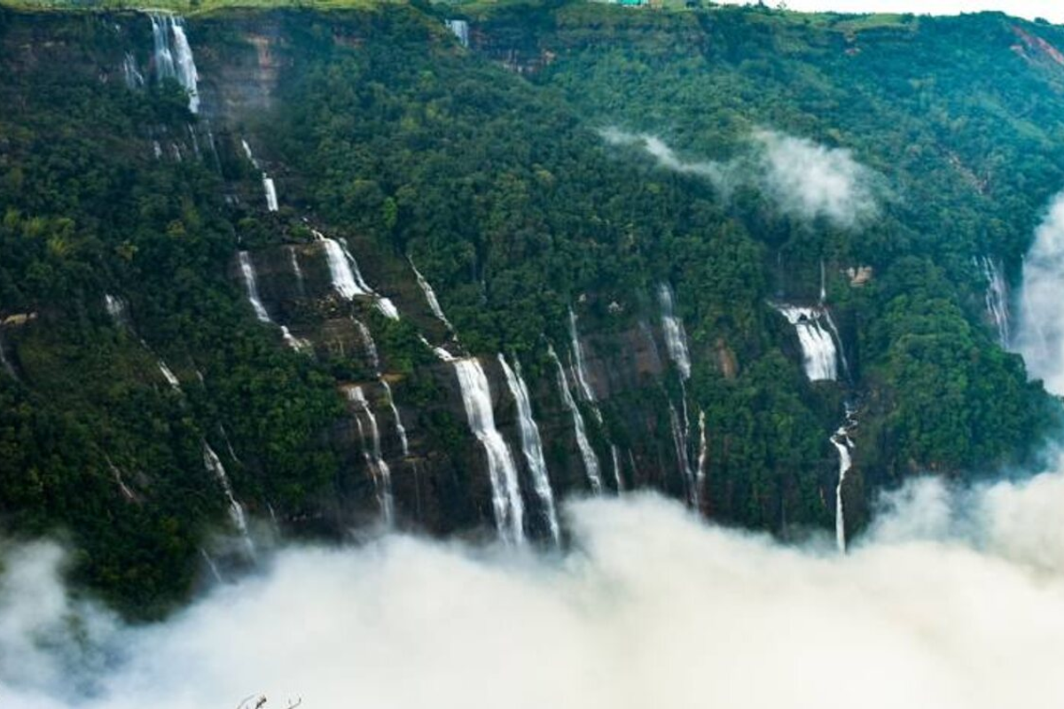 The thundering Nohkalikai Falls in Cherrapunji with a clear view of the plunge pool.