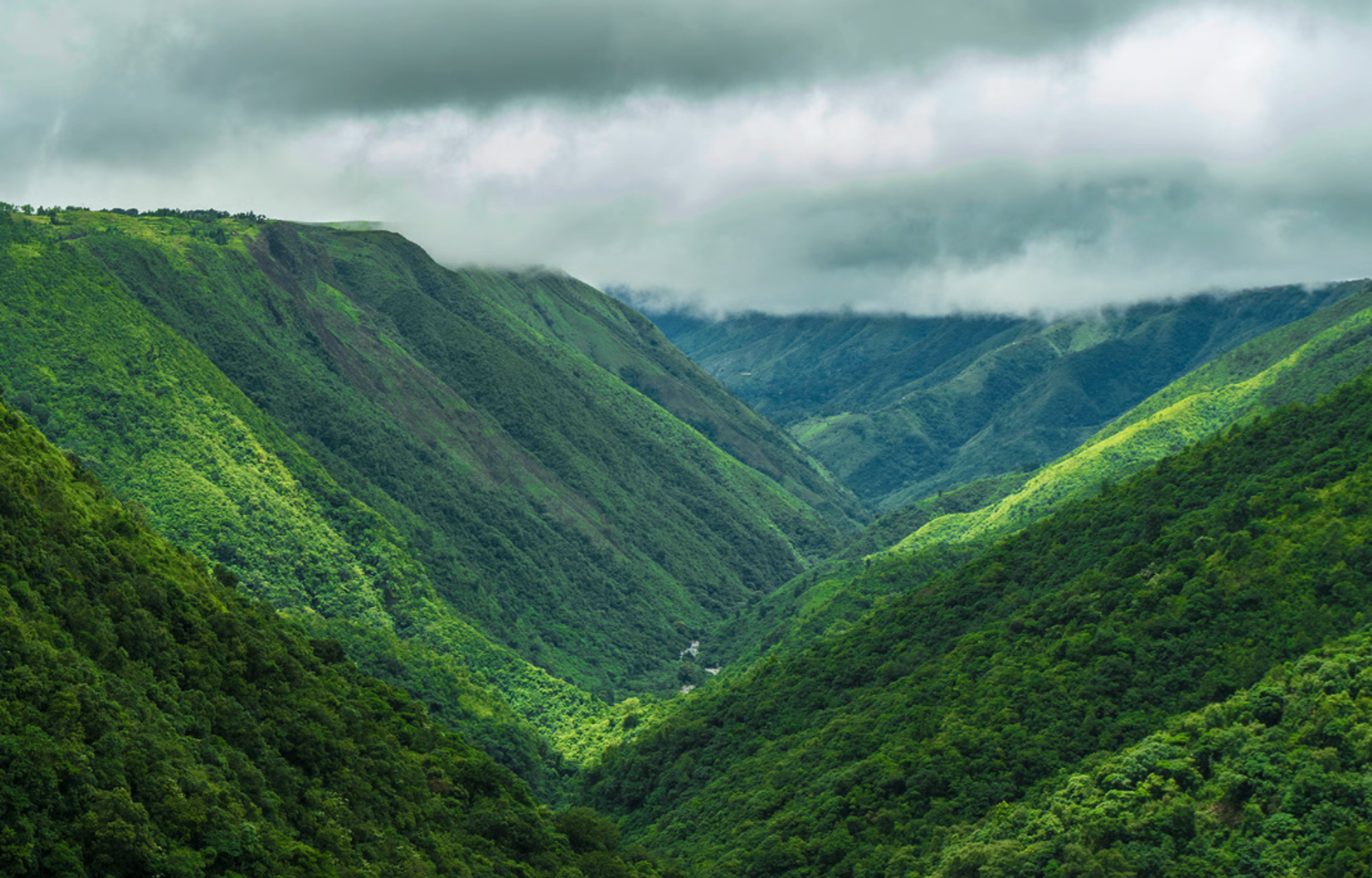 Looking deep into the vast chasm of the Mawkdok Dympep Valley from the roadside viewpoint.. Source: Meghalaya Tourism