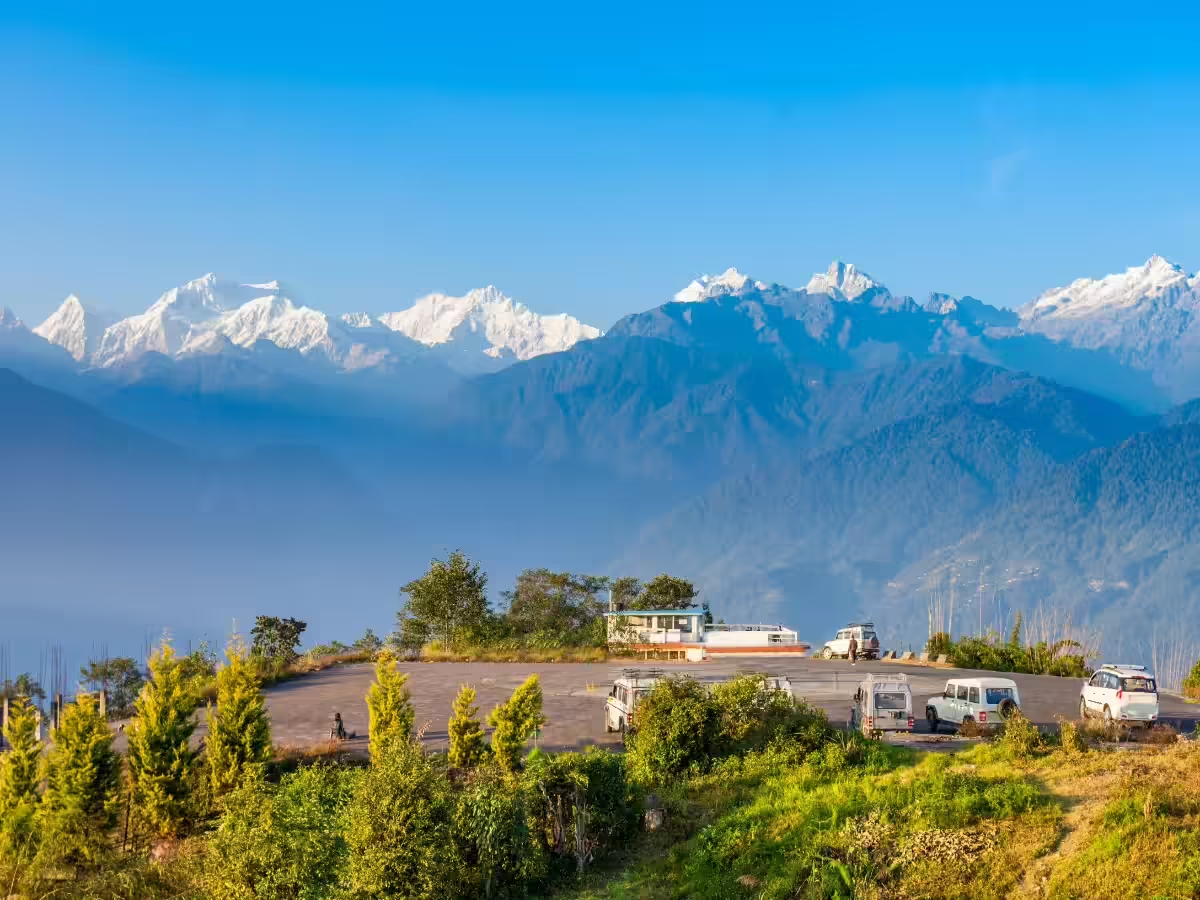 Panoramic mountain view of Pelling town West Sikkim with snow-capped Mt Kanchenjunga peaks.