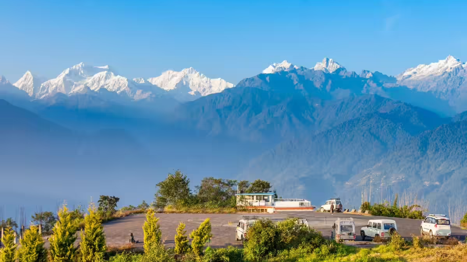 Panoramic mountain view of Pelling town West Sikkim with snow-capped Mt Kanchenjunga peaks.