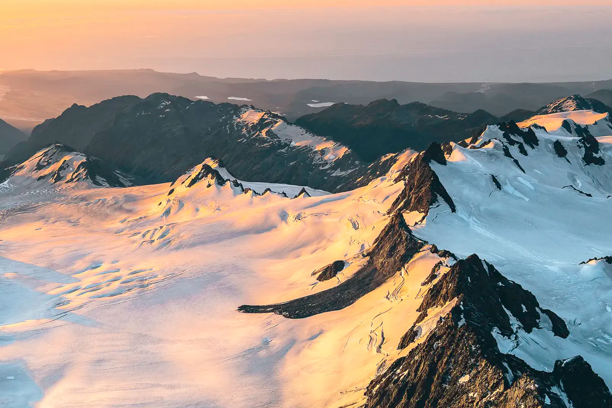 Professional camera gear with lens filters being used to photograph snow-capped mountains in North Sikkim.