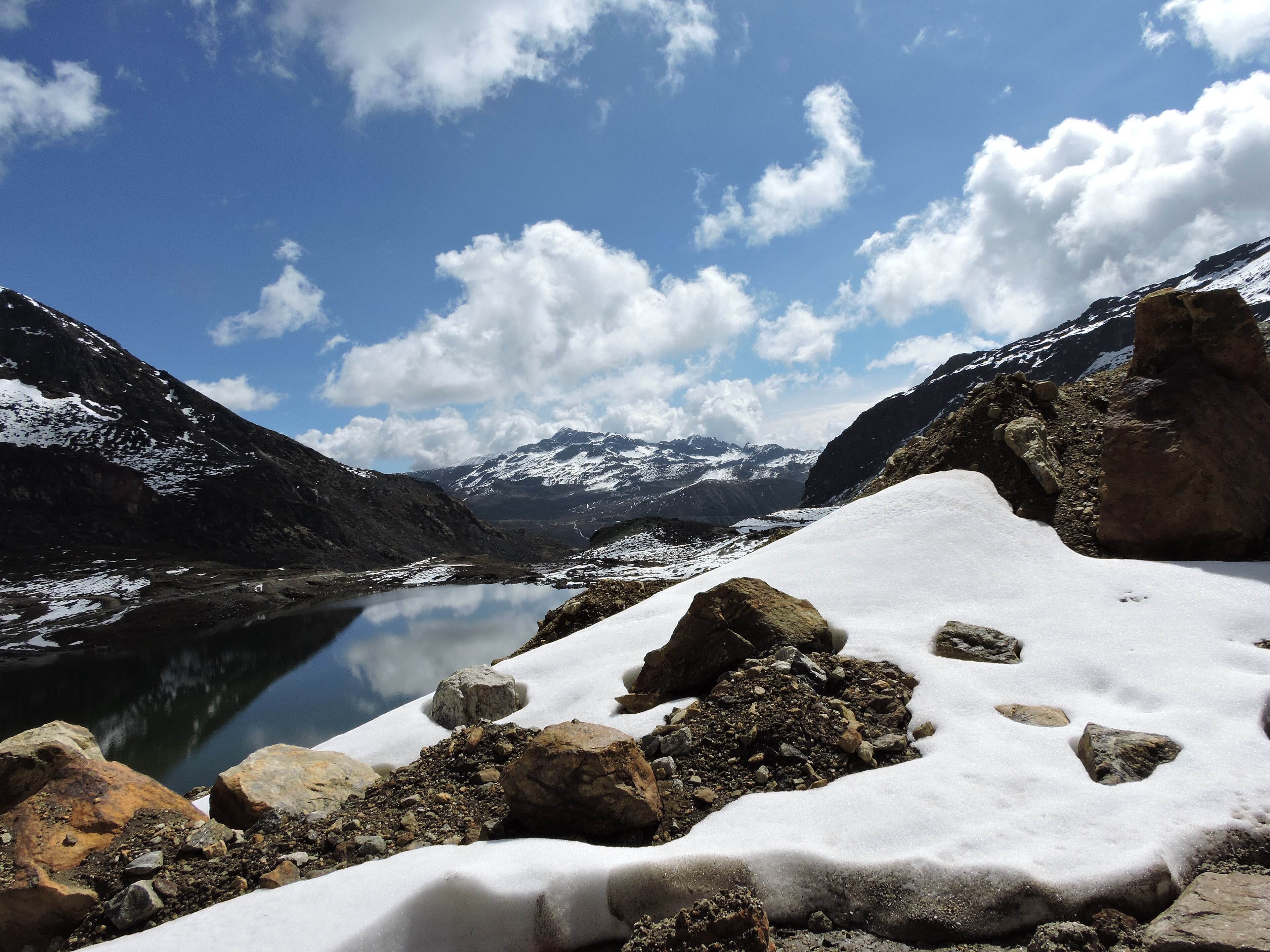 The high-altitude road to Bum La Pass above Tawang, with snow on the slopes
