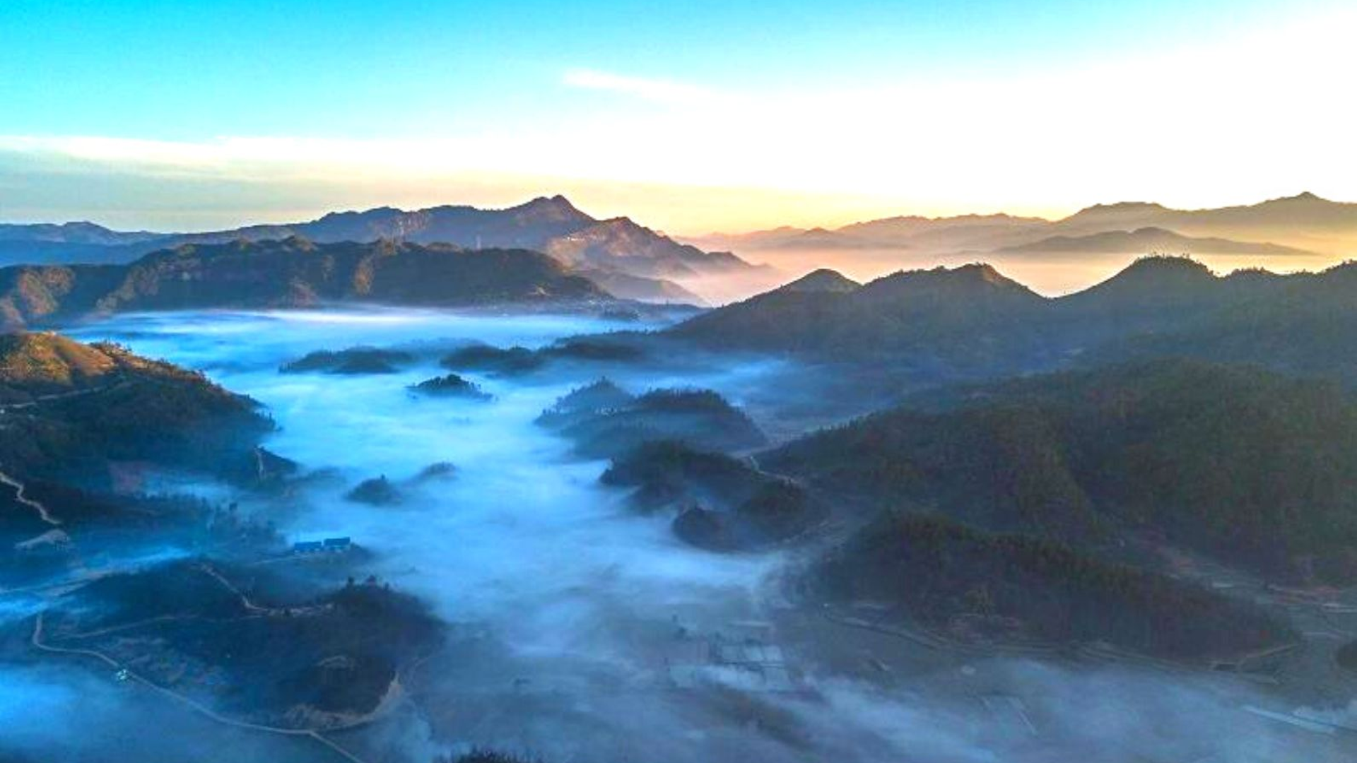 Phawngpui Blue Mountain peak with misty valleys, rhododendron forests and remote tribal villages in Lunglei district, Mizoram.