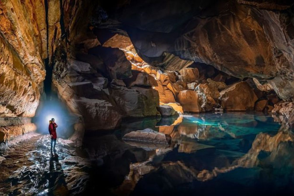 Illuminated limestone formations inside Mawsmai Cave in Cherrapunji, Meghalaya