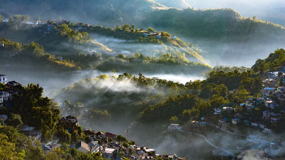 Lush green hills and landscapes of Mizoram in Northeast India showcasing the scenic beauty and peaceful mountainous environment of Mizoram.