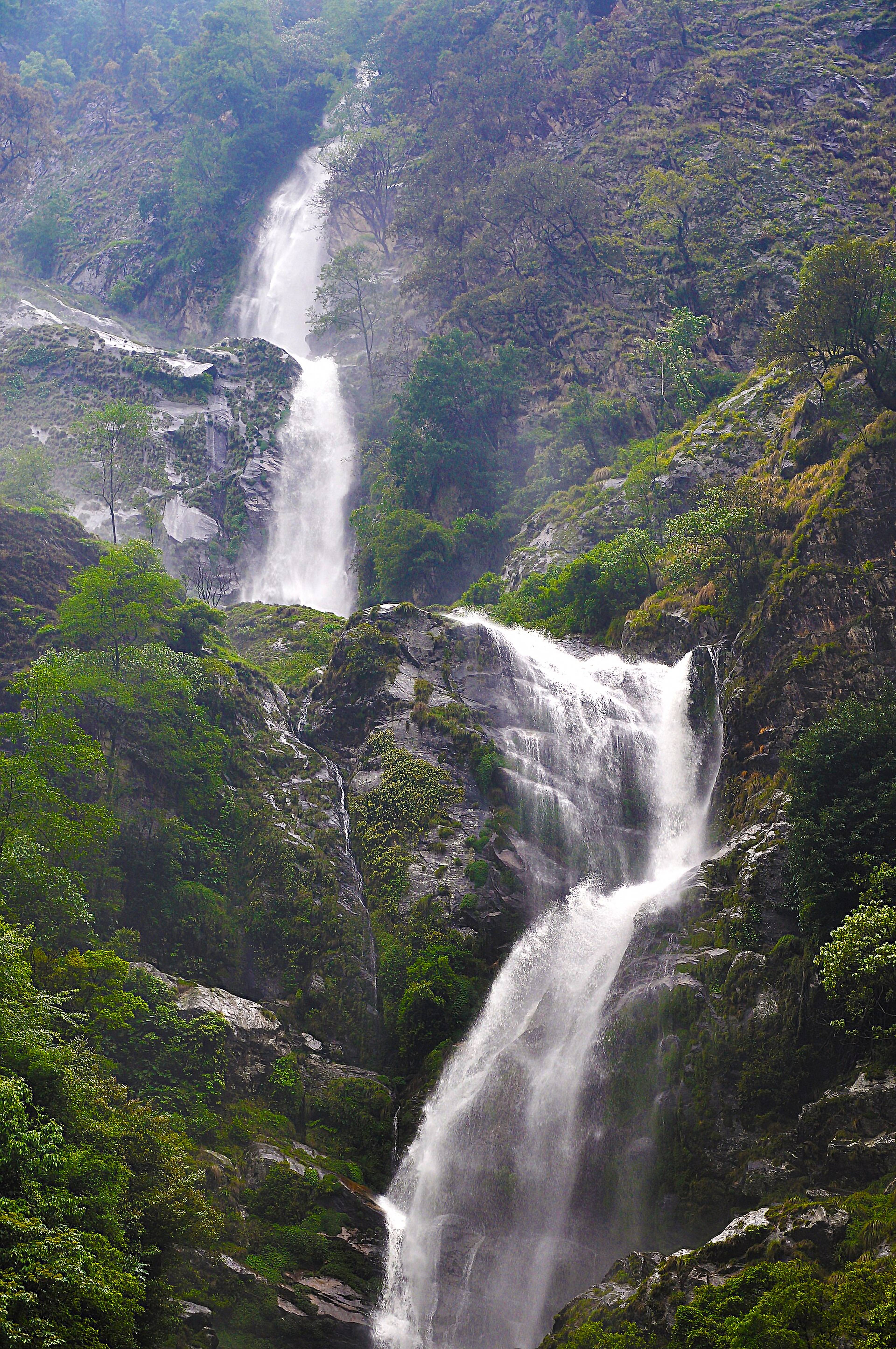 Bap Teng Kang waterfall falling over rocks in the forest near Lumla, Tawang