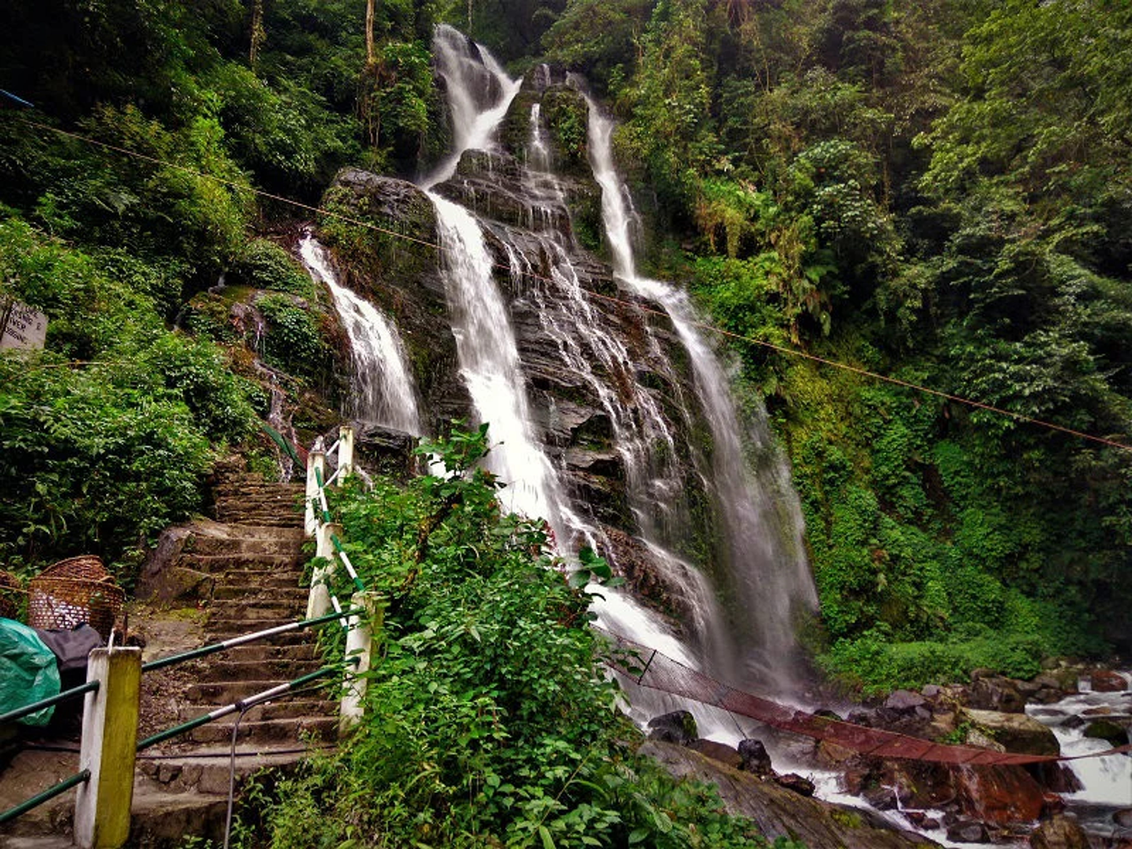 Powerful Kanchenjunga Waterfalls Pelling perennial cascade falling over rocks in West Sikkim.