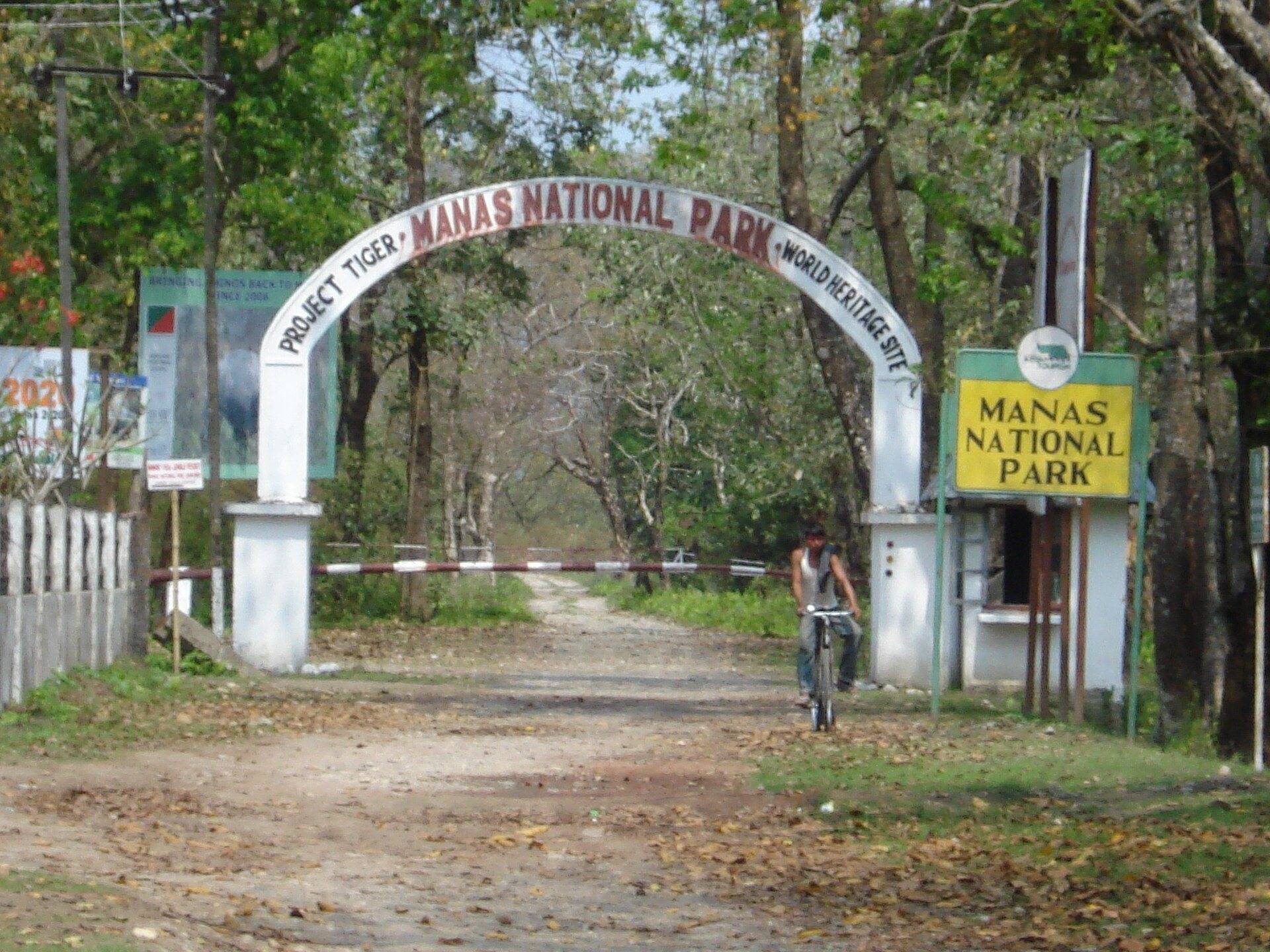 The entrance arch of Manas National Park on a forest road