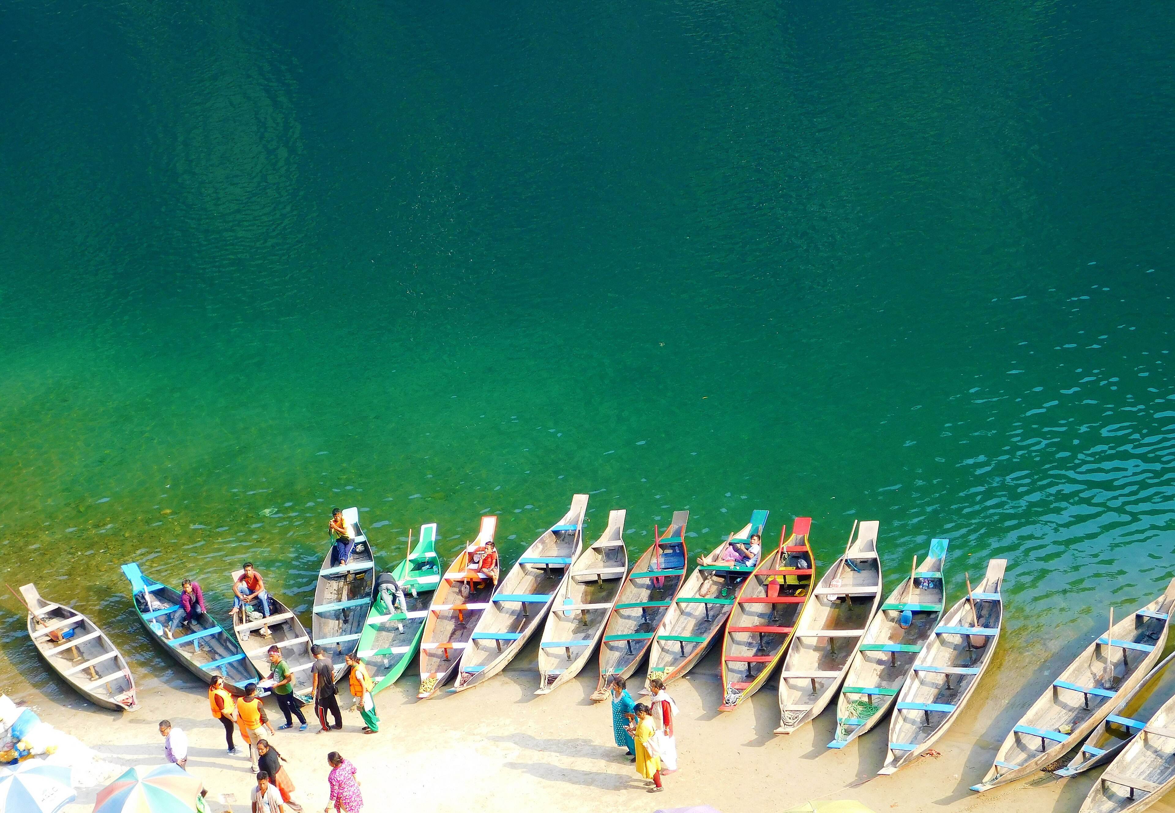 Rows of boats lined up on the emerald Umngot river at Dawki