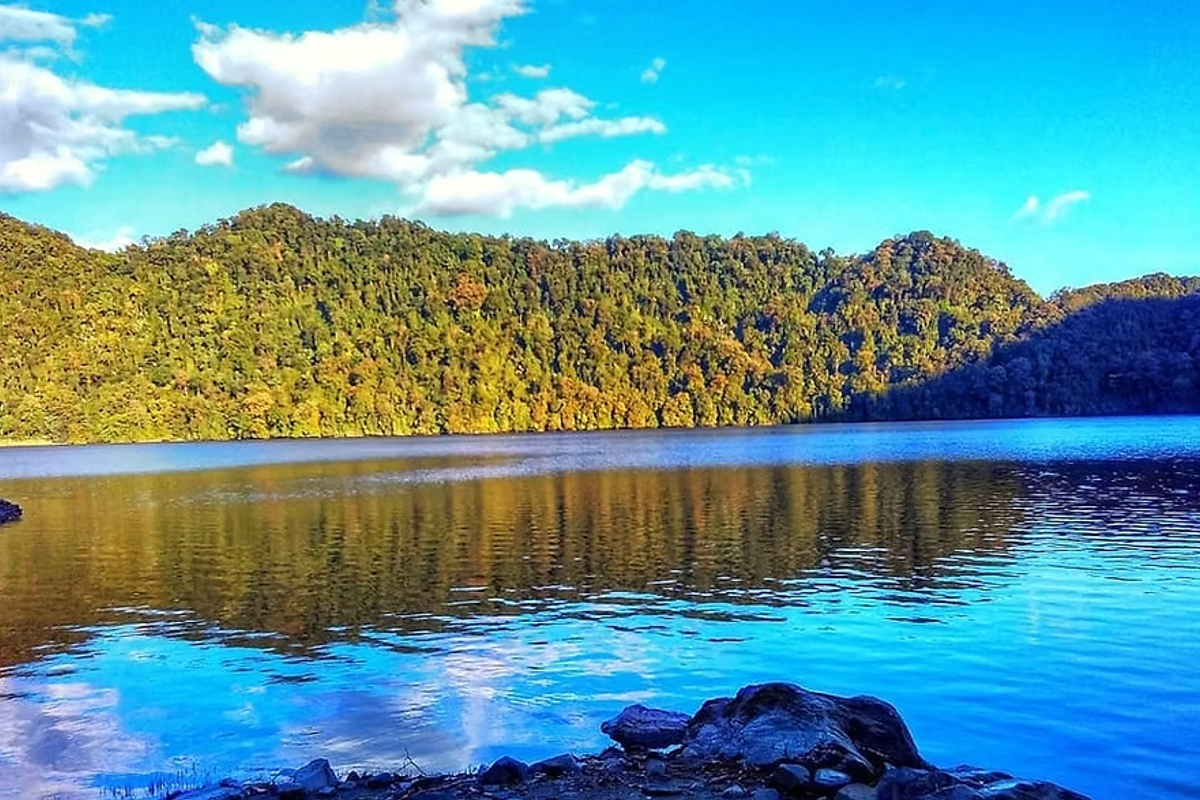 Crystal clear water of Mehao Lake surrounded by dense virgin forests in Mehao Wildlife Sanctuary.