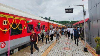 Sairang railway station building and platform with passengers near Aizawl