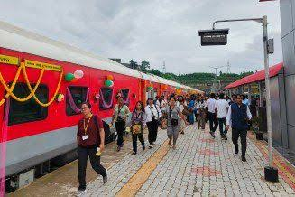 Sairang railway station building and platform with passengers near Aizawl