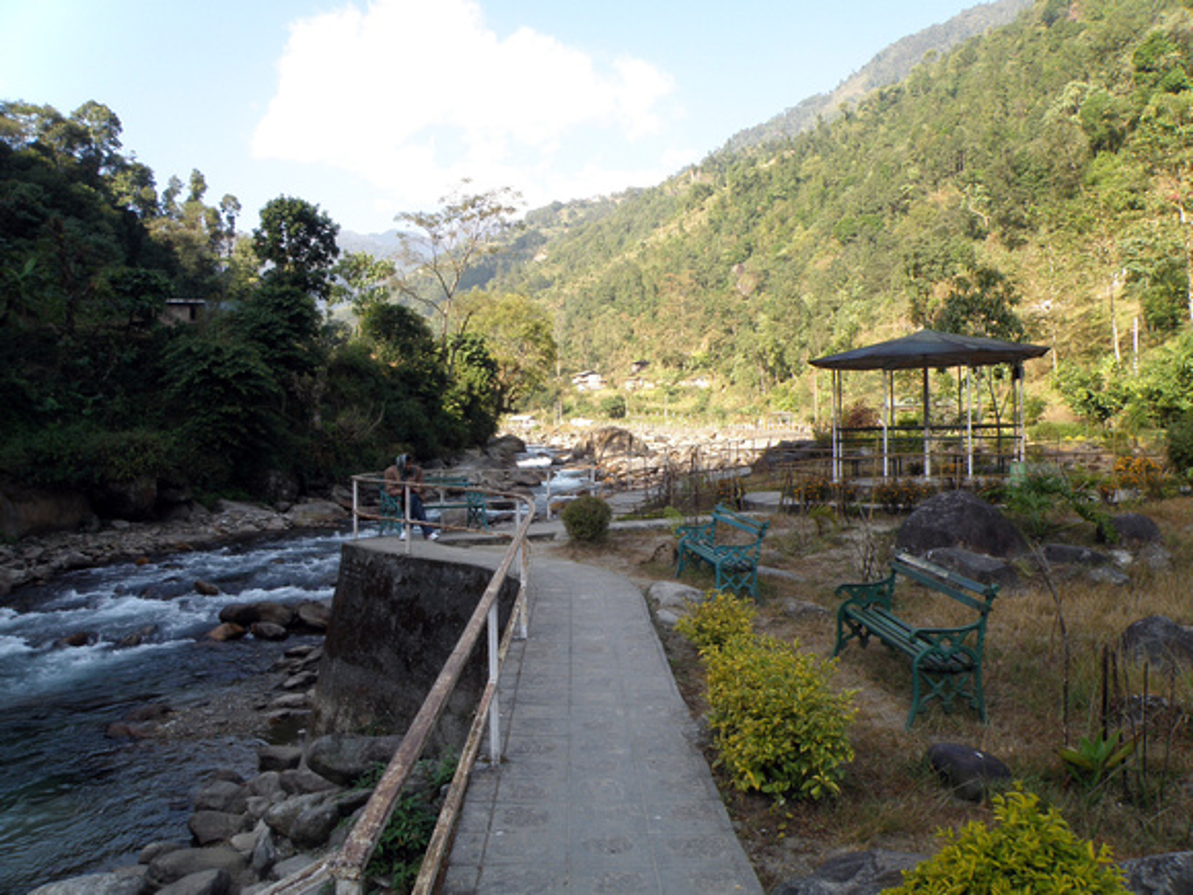 Pelling Sewaro Rock Garden showing riverside stone paths fountains and landscaped picnic area.